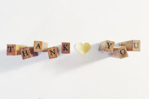 blocks spelling "Thank you" with a paper heart