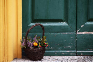 basket of flowers on a stoop