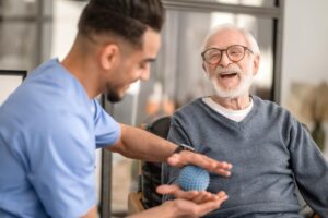Man talks to senior while preparing for respite care
