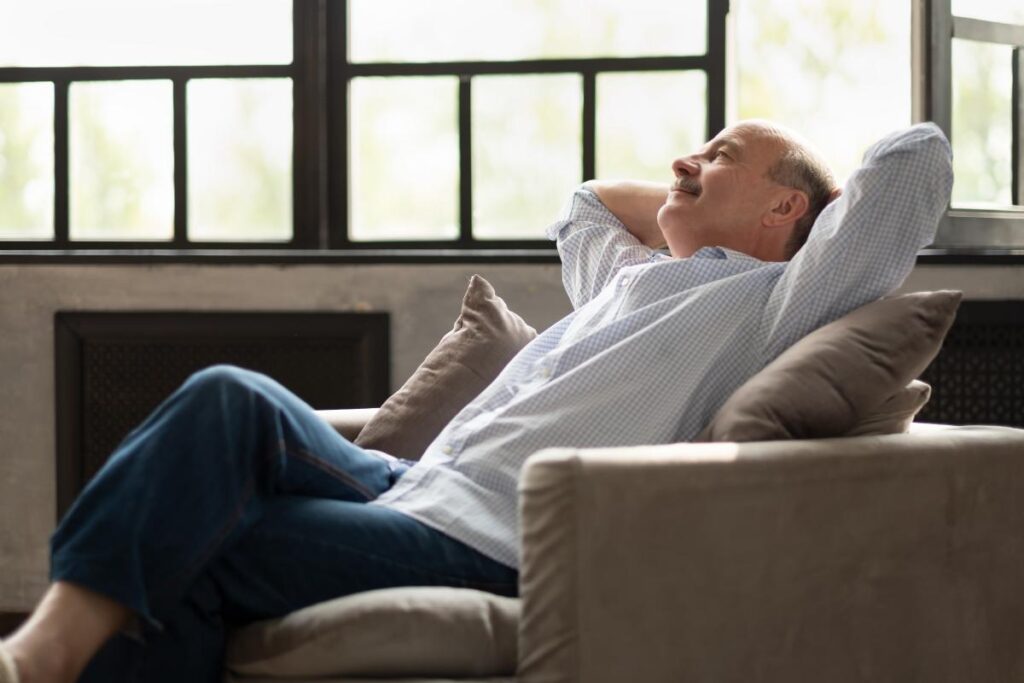 Man leans back in chair as he thinks about in home health care inmonticello mn