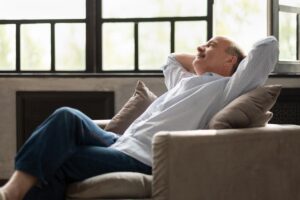 Man leans back in chair as he thinks about in home health care inmonticello mn