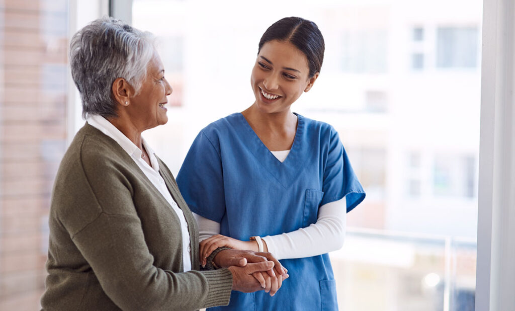 Nurse talks to senior about how maintenance therapy supports chronic disease in seniors