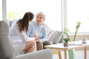 Woman talks to senior during home health care in Duluth, MN