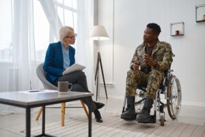 Veteran talks to therapist during home health services for veterans