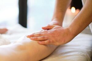 Person lays down and recieves lymphedema therapy 