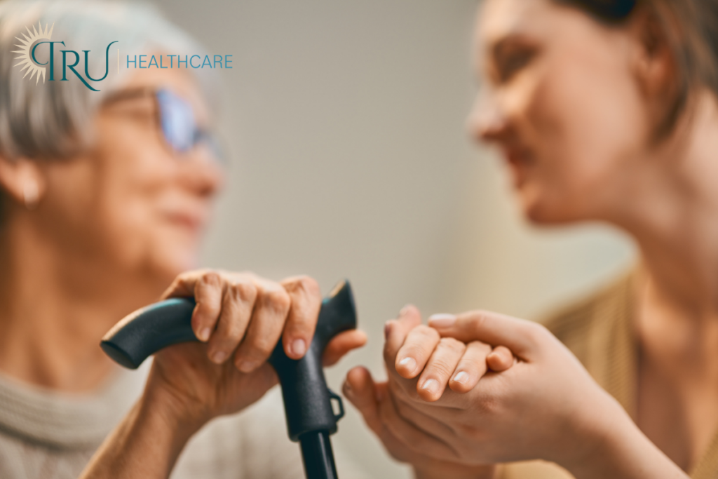Family Caregiver Holding Hand of Loved One